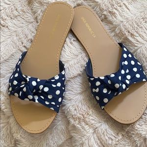 Navy blue polka dot slides